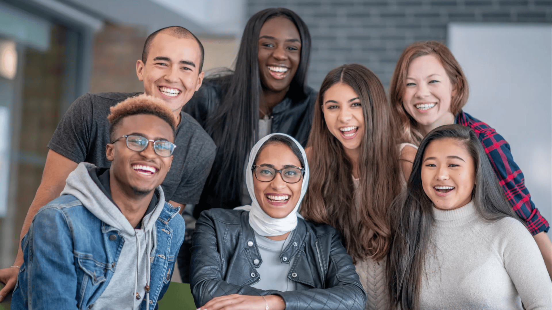 Diverse group of young leaders smiling together, representing teamwork, inclusion, and collaboration